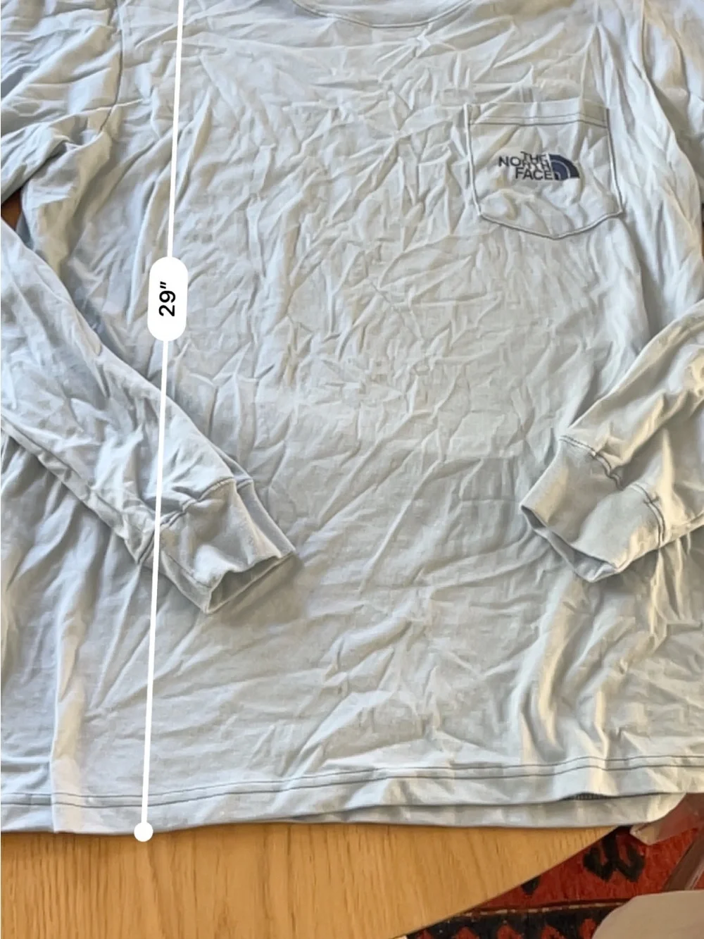 The North Face Men’s Long-Sleeve Pocket Tee with Carabiner graphic- Light Blue